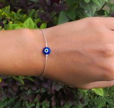 "Simple. Chic. Minimalist™ A perfectly dainty Blue Evil Eye is hanging on a delicate feminine Sterling silver chain. Evil Eye measures 8mm. Also available with 14K Gold filled / 14K Rose gold filled chain. Model is wearing 6.5\" length ❤️ Personalize it! Add a tiny letter charm to the clasp- https://www.etsy.com/listing/240726946/add-a-personalized-letter-charm?ref=shop_home_active_1 I can add a beautiful wire wrapped tiny white fresh water pearl to the clasp. Please visit this link: https://www Silver Evil Eye Jewelry, Minimalist Round Evil Eye Bracelet, Adjustable Blue Evil Eye Bracelet Nickel Free, Adjustable Nickel-free Blue Evil Eye Bracelet, Adjustable Blue Evil Eye Bracelet, Nickel Free, Minimalist Evil Eye Bracelet With Adjustable Chain As Gift, Everyday Blue Evil Eye Jewelry, Blue Eye Bracelet, Sterling Silver Evil Eye Bracelet With Adjustable Chain