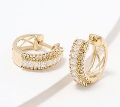 Diamonds. Every. Day. That's what you get with these huggie hoop earrings from Affinity. Consider them the haute hybrid of jewelry -- the ear-hugging silhouette has effortless everyday accent written all over it, while the remarkable sparkle speaks to those special occasions, sophisticated soirees, and milestone moments.\n\nOf course you can save them for a celebration (they'll be brilliant!), but why not make life's little moments just as bright? After all, you deserve to dazzle on the daily. F Formal Huggie Earrings With Halo Design, Formal Halo Huggie Earrings, Anniversary Halo Huggie Earrings, Fine Jewelry Huggie Earrings With Halo Design For Anniversary, Fine Jewelry Halo Design Huggie Earrings For Wedding, Fine Jewelry Huggie Earrings With Halo Design For Wedding, Fine Jewelry Wedding Huggie Earrings With Halo Design, White Diamond Cut Huggie Earrings, Luxury Halo Design Huggie Earrings For Anniversary