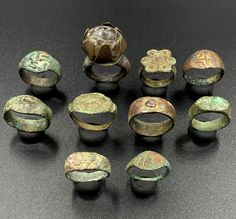 an assortment of ancient roman bronze rings and bracelets