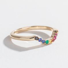 The Angela Monaco Jewelry Full Rainbow Contour Band is our second take on the AMJ Rainbow Sapphire Contour Band. For this beauty, we've added two diamonds to the original 14k yellow gold design to resemble The People of Color inclusive Pride flag which originated here in Philadelphia in 2017. 15% of all proceeds from the Full Rainbow Contour Band are donated to the Marsha P. Johnson Institute as part of our ongoing With Love and Pride campaign. Details Handmade in Philadelphia in 14K yellow gold Rainbow Contour, Inclusive Pride Flag, Pride Campaign, Full Rainbow, Contour Band, Chocolate Diamond, Rainbow Sapphires, Chocolate Diamonds, Love And Pride