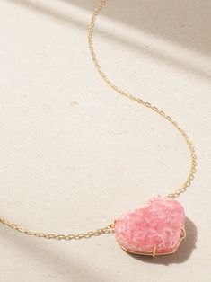 JIA JIA's necklace is strung with a 20.00-carat rhodochrosite - the natural veining and color make it completely one-of-a-kind, while the shape falls perfectly in-line with the Heart Chakra it's said to open. Part of the label's 'Crystalline' collection, it's handmade from 14-karat gold and has a delicate 20- to 22-inch chain that layers nicely with shorter styles. Unique Handmade Pink Crystal Necklaces, Handmade Pink Heart Crystal Necklaces, Playful Pink Heart Necklaces, Pink Rose Quartz Heart Pendant Jewelry, Rhodochrosite Necklace, Tanzanite Necklace, Hand-strung Pink Rose Quartz Necklace, Beads Jewellery, Citrine Necklace