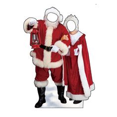 two people dressed up as santa claus and mrs claus holding a lantern in their hands