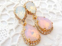 "Pink and white opal Chandelier earrings, Bridal earrings, Bridesmaids gift, Dangle earrings, Drop earrings, Weddings jewelry, Swarovski earrings, Powdered pink, Blush pink, Beauty with Statement. These stunning earrings have a great statement look that can't be missed. They would be great bridal earrings or with an evening dress. Wonderful bridesmaids' gift They are made of 14k gold plated brass posts, Swarovski crystals, all set in prong setting. Made with CRYSTALLIZED™ - high qulity genuine S Silver Opal Earrings For Wedding, Opal Jewelry With Matching Earrings For Wedding, Opal Drop Earrings For Wedding, Bridesmaid Earring, Blue Bridal Earrings, White Opal Earrings, Earrings Chandelier, Earring Dangle, Earrings Bridesmaid