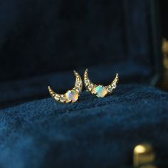 Celestial-Crescent-Moon-Opal-Stud-Earring-18K-Gold-The-Chubby-Paw Celestial Crescent Jewelry With Birthstone, Elegant Crescent Birthstone Jewelry, Elegant Crescent Shaped Birthstone Jewelry, Elegant Crescent-shaped Birthstone Jewelry, Dainty Moon-shaped Birthstone Jewelry, Elegant Crescent Moonstone Jewelry, Fine Jewelry Moon-shaped Gift, Moon Shaped Fine Jewelry Gift, Celestial Yellow Gold Earrings With Gemstone