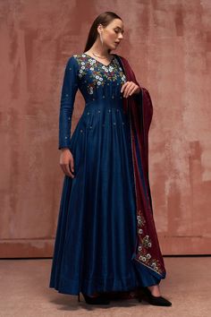 Peacock blue anarkali with floral embroidered bodice. Comes with contrast maroon dupatta.
Component: 2
Pattern: Embroidered
Type Of Work: Floral Motifs
Neckline: V-Neck
Sleeve Type: Full
Fabric: Tussar Silk, Satin Silk
Color: Blue
Other Details: 
Back cut-out
Padded
Fully lined
Closure: Back zipper and hook
Occasion: Puja - Aza Fashions Maroon Anarkali, V Neck Anarkali, Anarkali With Dupatta, Blue Anarkali, Embroidered Anarkali, Embroidered Bodice, Floral Motifs, Embroidered Silk, Anarkali