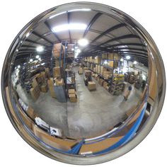 an image of the inside of a warehouse with boxes and pallets in it's reflection