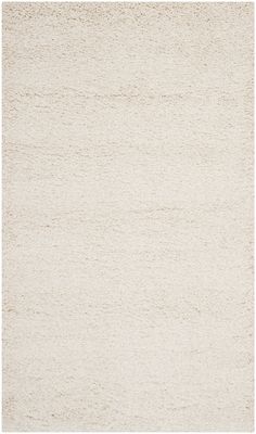 an area rug with white and beige colors