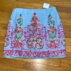 Nwt Local Boutique (Tiffany Lane) Embroidered Mini Skirt (Brand Entro). Size Medium. Beautiful Light Denim/Linen Material With Lining Under Skirt And Colorful Design Embroidery. Zips Up The Back. Never Been Worn! Multicolor Embroidered Mini Skirt, Pink Embroidered Skirt, Blue Embroidered Mini Skirt, Fitted Multicolor Skirt With Floral Embroidery, Fitted Blue Skirt With Floral Embroidery, Pink Embroidered Bohemian Skirt, Bohemian Pink Embroidered Skirt, Embroidered Blue Mini Skirt, Spring Mini Skirt With Multicolor Embroidery