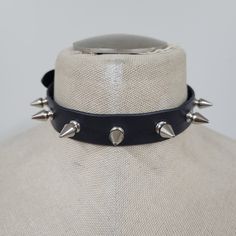 Handmade leather choker adjustable from 13 inches up to 16 inches. (13", 13 1/2", 14", 14 1/2", 15", 15 1/2", 16") leather is ~ 1.8 to 2.2 MM thick choker contains 7 spikes (0.5 inch in lenght) Adjustable Gothic Choker For Alternative Fashion, Edgy Black Spiked Choker, Punk Spikes Choker For Party, Punk Spiked Choker For Parties, Adjustable Edgy Festival Choker, Edgy Spiked Choker For Party, Gothic Spiked Choker For Festivals, Edgy Adjustable Festival Choker, Edgy Adjustable Choker For Festival