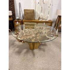 a glass table with gold leaf design on it