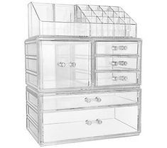 three clear drawers are stacked on top of each other, one is open and the other is closed