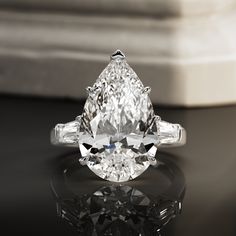 an oval cut diamond with baguetts on the side