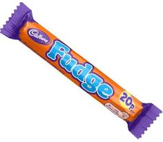 an orange and purple candy bar sitting on top of a white surface with the word pride written