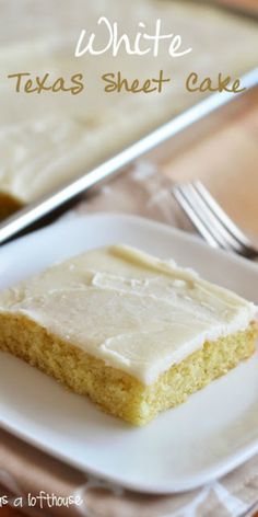 a piece of cake sitting on top of a white plate next to a knife and fork