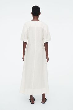 PLEATED A-LINE MIDI SHIRT DRESS - WHITE - COS Neck Piece, Midi Shirt Dress, White Shirt Dress, Knitwear Cardigan, Mother Of Pearl Buttons, Flared Skirt, Dress Trousers, Shop Swimwear, New Arrival Dress