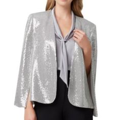 Nwt Tahari Asl Women Metallic Sequined Cape Blazer Sequin-Covered Jacket With Side Pockets And Hook & Eye Closure. Open Front Long Cape Sleeves Dry Clean Material: 91% Nylon/6% Elastane/3% Other Fibers Size Small Color Silver Gold New With Tag Dry Clean ` Elegant Silver Blazer For Evening, Elegant Silver Evening Blazer, Silver Blazer For Night Out, Elegant Silver Blazer For Work, Elegant Silver Blazer For Workwear, Elegant Silver Blazer For Night Out, Elegant Silver Sequined Outerwear, Elegant Metallic Outerwear With Sequins, Elegant Metallic Sequined Outerwear