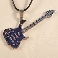 This Beautiful Blue Electric Guitar Pendant Is Made Of Stainless Steel. Hand Painted Enamel. Hypoallergenic, Brand New And Never Been Worn. Comes With A Faux Leather Necklace. This Fine Quality Pendant Is Perfect For All Day Everyday Wear Or A Special Gift. Get An $18 Gift Of Your Choice In My Listings With Purchase Of Two Or More Items. Please Send Offers And Questions. Necklace: Approximately 17.5" + 2" Extension Chain With Lobster Clasp Pendant: 60x22mm Or 2.36" X .86" Wt. 8g New To Poshmark? Electric Guitar Blue Aesthetic, Cheap Adjustable Music-themed Necklaces, Light Blue Guitar, Ice Blue Electric Guitar, Viking Skull, Blue Electric Guitar, Dark Blue Electric Guitar, Silicone Wedding Rings, Stainless Steel Cross Pendant