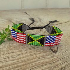 Friendly beaded bracelet with Jamaica and USA flags. Loom hand woven wristbandt is a great gift for a men, women, or child for American Independence Day, Birthday, Christmas, Valentine's Day and other holidays.  Is suitable for daily wear. Bracelet in stock and ready to ship. -------------------------------------------------- More bracelets with flags here: https://www.etsy.com/shop/BeadSeeShop?ref=seller-platform-mcnav&section_id=36120104 ------------------------------------------------ The bra Multicolor Resizable Beaded Bracelet As Gift, Multicolor Resizable Beaded Bracelet For Gift, Multicolor Resizable Beaded Bracelet Gift, Resizable Multicolor Beaded Bracelet Gift, Black Handwoven Friendship Bracelets As A Gift, Multicolor Beaded Friendship Bracelets As Gift, Multicolor Beaded Friendship Bracelets For Gift, Casual Handwoven Beaded Bracelets As Gift, Casual Handwoven Bracelets For Gifts