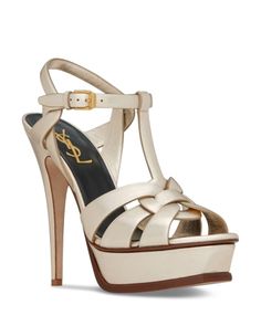 Saint Laurent Tribute Sandals in Metallic Leather Luxury T-strap Heels For Summer, High-end Open Toe Summer Sandals, High-end Open Toe Sandals For Summer, Gold Open Toe Luxury T-strap Sandals, Luxury Gold T-strap Sandals, Luxury Gold T-strap Sandals With Open Toe, Luxury Gold T-strap Open Toe Sandals, Gold Luxury Open Toe T-strap Sandals, Luxury Evening Sandals With Buckle Closure