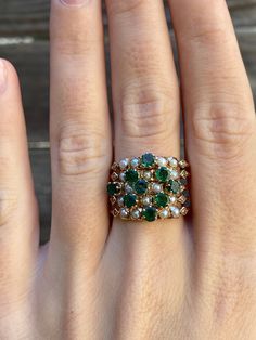 Total Weight: 8.1 grams Size: 7.5 Width: Each band is 1.2mm  Total Band Width: 11.3mm Diamonds: 1mm Emerald: 3mm Seed Pearls: 1.9mm Condition: In great condition showing little wear with no damage. All gold has been thoroughly checked with an Olympus XRF spectrometer. It is guaranteed 14k gold.  All our jewelry is properly washed and disinfected to ensure customers get clean items with every order.  Returns accepted but may be subjected to a restock fee.  Please message with any questions:) Jewelry Real, Seed Pearl, Emerald Diamond, Ring Size 7, Estate Jewelry, Wedding Engagement, Band Rings, Wedding Bands, Emerald