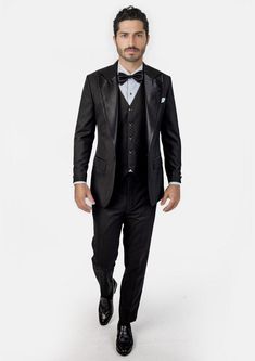 Crafted from a luxurious sharkskin weave wool, the Liberty Black Tuxedo is a sophisticated, statement-making formalwear option. Wide peak lapels in a single button configuration stand out from typical tuxedo styles. Dress to impress with this high-end, premium garment – a modern blend of elegance and refinement. Tuxedo Suits For Black-tie Gala Events, Black Tie Tuxedo Blazer With Hidden Button Closure, Tuxedo Blazer With Hidden Button Closure For Black Tie, Tuxedo With Suit Collar For Gala, Wool Tuxedo With Hidden Button Closure, Gala Tuxedo With Suit Collar, Fitted Tuxedo For Gala, Notch Lapel Tuxedo For Black-tie Gala Events, Notch Lapel Tuxedo For Black-tie Events