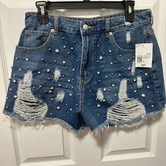 Brand New With Tags, These Denim Shorts Are Perfect For Your Summertime Concerts And Festivals. 100% Cotton. Shorts Are Embellished With Rhinestones And Silver Beads Throughout The Front. I Purchased These Recently But Unfortunately Could Not Fit Them. High Waist Rhinestone Denim Jeans, High Rise Denim Bottoms With Rhinestones, Trendy Denim Blue Bottoms With Rhinestones, Trendy High Waist Jeans With Rhinestones, Spring Denim Blue Bottoms With Rhinestones, Denim Blue Embellished Bottoms, Denim Blue Rhinestone Bottoms For Spring, Spring Denim Blue Rhinestones Bottoms, Denim Blue Rhinestones Bottoms For Spring