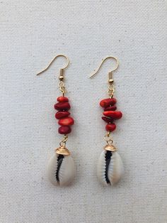 two pairs of earrings with red and white beads