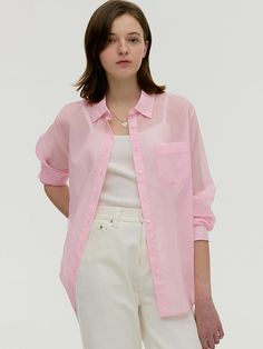 This product is a glow sheer shirt that exudes a light and airy feel, perfect for layering over casual or dressy outfits. It features a delicate, translucent fabric that adds a touch of elegance and softness to the overall look. The relaxed fit and adjustable drawstring at the waist provide both comfort and a customizable silhouette. - This shirt is crafted with a lightweight sheer fabric, offering a breezy, ethereal quality ideal for spring and summer days.- Designed with a button-down front and classic collar, it combines traditional shirt elements with a modern, sheer twist.- The adjustable drawstring waist allows the wearer to tailor the fit to their liking, enhancing the shirt's versatility.- Its long sleeves can be rolled up for a more relaxed look or left down for a more formal Casual Long Sleeve Sheer Shirt, Feminine Pink Shirt For Summer, Feminine Pink Summer Shirt, Pink Relaxed Fit Feminine Shirt, Spring Sheer Blouse For Layering, Sheer Blouse For Spring Layering, Summer Blouse With Sheer Sleeves For Daywear, Summer Blouse With Sheer Sleeves For Layering, Feminine Sheer Tops For Layering