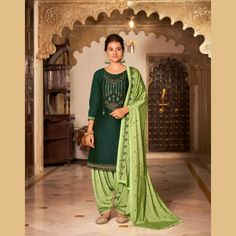 Designer Patiala Suit - Chiro's By Jigyasa Green Kurta With Mirror Work And Traditional Drape, Green Churidar With Mirror Work In Traditional Drape, Green Churidar With Mirror Work, Green Kurta With Dori Work In Traditional Drape, Designer Green Churidar With Mirror Work, Green Chanderi Churidar For Navratri, Green Kurta With Pallu In Traditional Drape, Green Churidar With Traditional Drape In Chanderi, Green Churidar With Mirror Work For Navratri