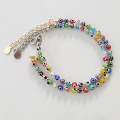 Rainbow Evil Eye Rainbow Beaded anklet bracelet and choker, Evil eye jewelry, Boho,Beach Jewelry,Summer,Festival ,Yoga Gift Present,Protection Bracelet Handmade Bracelet with Rainbow Evil Eye MATERIAL ♥ Glass Beads evil eye size 4mm ♥ Gold Plated/ Silver Plated Beads size 2mm ♥ 2 inch extender chain (5cm) SIZE ♥ Adjustable size bracelet 5.5 - 7 inches ♥ Adjustable size anklet 8.5 - 10.5 inches ♥ Adjustable size choker 12 - 15 inches Please message me the size of your request! White Beaded Choker For Festivals, Multicolor Round Beads Anklets For Gift, Multicolor Beaded Chain Anklets As Gift, Multicolor Round Beads Anklets As Gift, Trendy Anklets With Round Beads For Festivals, Gift Multicolor Round Beads Anklets, Gift Multicolor Round Bead Anklets, Trendy Handmade Multicolor Anklets, Trendy Multicolor Handmade Anklets