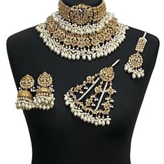 Asian jewellery set. Set includes- Necklace (2 piece, necklace and choker) Earrings  Tikka Jhumar White Kundan Jewelry For Eid, Ceremonial Kundan Jewelry For Diwali, White Chandbali Jewelry For Ceremonial Occasions, White Chandbali Ceremonial Jewelry, Heavy Jewelry For Diwali Celebration, Ceremonial Bollywood Jewelry For Festivals, Festive Gold-plated Bridal Sets, Heavy White Jewelry For Festive Season, Ceremonial Gold Lehenga For Eid