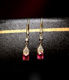 *Condition: Brand new *Center Stone: Natural Red Spinel, Cushion Cut, approx 1.6ct total, 5.5x4.5mm *Side stones: Natural White Diamond Round-cut (VS1 clarity and F color) *Earrings Dimension: 3.5 x 26 x 3mm *Metal Purity: Can be select Each piece is made-to-order with care and special attention to detail. all items are made with conflict-free diamonds and gems. Size: made to order The item will be gift wrapped and shipped. ------------------------------------------------------------------- Avai Elegant Red Jewelry For Formal Occasions, Elegant Red Gemstone Jewelry, Elegant Red Dangle Jewelry, Pink Gold Drop Earrings For Anniversary, Elegant Red Jewelry With Matching Earrings, Elegant Red Jewelry For Anniversary, Gold Ruby Earrings For Formal Occasions, Red Oval Earrings For Formal Occasions, Red Pierced Earrings For Formal Occasions