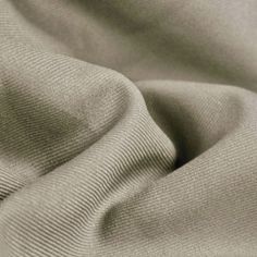 Delaney GREY Polyester Gabardine Fabric by the Yard for Suits, Overcoats, Trousers/Slacks, Uniforms - 10056 Prominent diagonal rib on the face and and smooth surface on the back. Gabardine is a tough, tightly woven fabric used to make suits, overcoats, trousers, uniforms, windbreakers and other garments. Content: 100% polyester Stretch: Minimal to none Width: 58 to 60 inches Weight: 280 Grams per Square Meter Edge: Straight Uses: Suits, overcoats, trousers, uniforms, costumes, crafts, etc. DISCLAIMER: Expedited shipping options do not apply to 5, 10, 50 and 100 yard options. Sample/Swatch: 4x2 inches for $4.99 each, free shipping. We highly suggest buying a sample first to see and feel the fabric if you are unsure of the color before buying yards. Wholesale: 20 yards or more per color Cut Gray Stretch Bottoms In Seamless Fabric, Gray High-stretch Elastane Bottoms, Light Grey Color Fabric, Gabardine Fabric, Grey Wool Fabric, Light Grey Fabric, Square Meter, Cut And Color, Fabric By The Yard