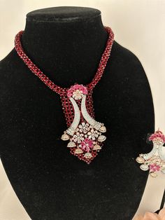 Beautiful vintage and hydro beads necklace with silver diamond work and a modern luxurious look for any jewelry lover! This necklace comes with matching earrings that are perfect to wear alone for a lighter look. High Quality Silver and Ruby finish with beaded work, this set is sure to be a perfect addition to any wardrobe! This lightweight and elegant necklace is perfect for any bridesmaid, bride, sangeet or any occasion or event as a gift for any occasion as any one who loves jewelry will love Elegant Red Choker For Formal Occasions, Red Ruby Jewelry Sets For Party, Elegant Red Beaded Jewelry Set, Ruby Necklaces With Sparkling Stones For Party, Party Ruby Necklaces With Sparkling Stones, Red Crystal Bridal Necklace For Party, Party Ruby Necklace With Sparkling Stones, Elegant Red Bridal Necklace With Sparkling Stones, Red Bridal Necklace For Party