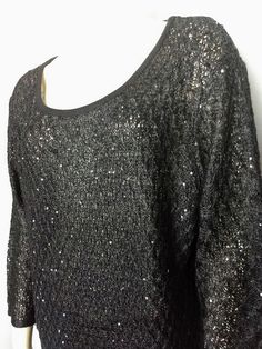 "Beautiful black top with mini sparkling black sequins Can be used for many occasions. *Brand: NICOLE ALEXANDER *Fabric: 50% Acrylic 45% Rayan * Measurement: * Size: XL ( please check the numbers) *Shoulder: 19\" *Bust: 23\" *Length: 26\" *Sleeve: 19\" *Excellent condition Thank you for visiting my store. You can also visit my \" MargaretJewelryPlus\" at https://www.jewelryandclothing.net/" Black Tops For Christmas Party, Elegant Crew Neck Sweater For Party, Sequined Sweater For Night Out In Winter, Long Sleeve Tops For Winter Holiday Party, Winter Night Out Sweater With Sequins, Long Sleeve Sequin Sweater For Night Out, Winter Night Out Sequin Sweater, Black Party Tops For Christmas, Black Christmas Party Tops