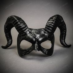 This Devil Mask With Back Twisted Horns Is Made From Plastic, Then Decorated And Hand Painted To Give It An Beautiful Black Texture Look. The Mask Is About 12" Tall And 14" Wide. The Masquerade Mask Will Make A Great Costume Accessory. Product Feature Made From Plastic With Plastic Plastered And Handcrafted And Hand Painted. Great For A Masquerade Ball, Venetian Costume, Halloween Costume Features Mythological Beasts May Also Be Used As A Display Piece Hand Painted With An Unique Texture Finish Demon Masquerade Mask, Unique Masquerade Mask, Masquerade Mask Aesthetic, Mythological Beasts, Ram Mask, Ballroom Extravaganza, Party Eye Mask, Mask Inspiration, Venetian Costume