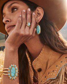 Our fan-favorite band ring goes on a trip out West in the Elyse Vintage Gold Etch Frame Band Ring in Variegated Turquoise Magnesite. Featuring our signature stone shape and an etched metal frame, this wear-anywhere statement is full of personality. This ring is a part of Yellow Rose by Kendra Scott—a brand that celebrates ranch life with Kendra Scott staples alongside select curated jewelry pieces and accessories. Metal Vintage 23k Yellow Gold Over Brass Material Variegated Turquoise Magnesite S Jewelry Brand Photography, Gold Western Jewelry, Turquoise And Gold Jewelry, Gold Turquoise Jewelry, Vahan Bracelets, Gold And Turquoise Jewelry, Western Turquoise Jewelry, Pink Quartzite, Turquoise Jewelry Gold