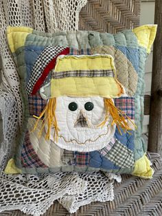 a decorative pillow with a face on it