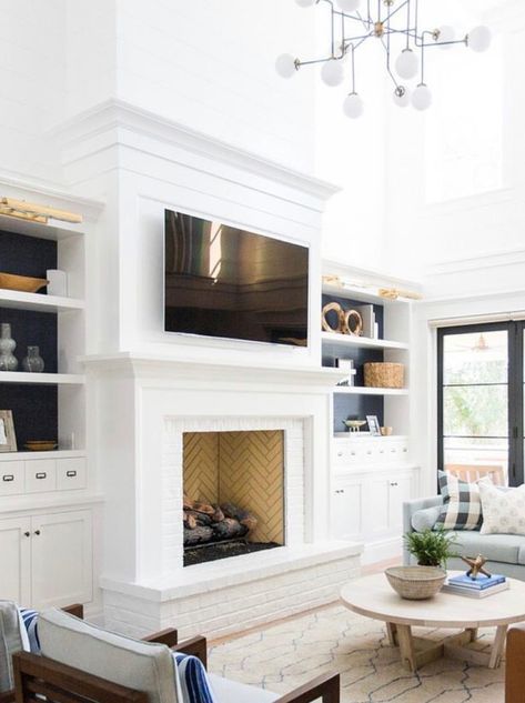 White Fireplace With Hearth, Fireplaces With Raised Hearth, Fireplace With Bench And Built Ins, Fireplace Next To Hallway, Keeping Room Fireplace, Raised Brick Hearth, Fireplace Surround Built Ins, Tall Fireplace Surrounds, Fireplace With Tall Hearth