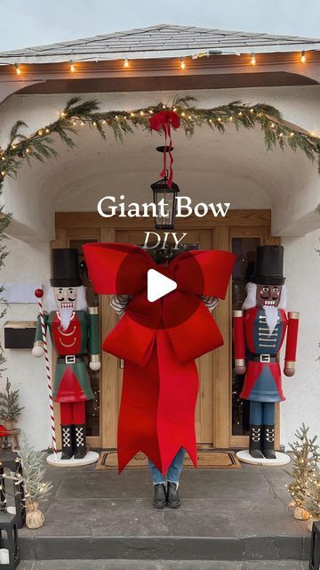 Christmas Decor Ideas Trending, Wreath On Lamp Post, Giant Outdoor Wreath On House, Christmas Decor Ideas Ballons, Giant Christmas Wreath On House, Bows On Front Porch Lights, Standing Christmas Decorations, Outside Arch Christmas Decor, Large Front Window Christmas Decor