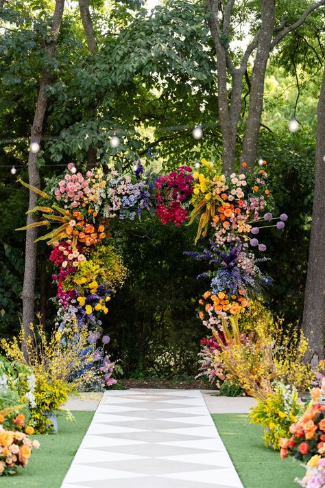 This Whimsical Texas Wedding Was an Explosion of Vibrant Florals Colorful Wildflowers Wedding, Whimsical Wedding Altar, Colorful Wedding Arch Ideas, Rainbow Wedding Florals, Whimsical Decor Wedding, Vibrant Wedding Florals, Bright Floral Wedding Decor, Colorful Forest Wedding, Garden Party Wedding Decor