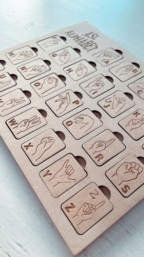 "This wooden Puzzle is a multi educational, A great way to learn how to finger spell and also learning the alphabet in American Sign Language. Size: width 11\"x height 9\"" Making Money With A Laser Engraver, Laser Engraving Projects, Glowforge Puzzle, Xtool Projects, Wood Educational Toys, Glowforge Name Puzzle, Laser Educational Toys, Scroll Saw Name Puzzle, Puzzle Logo