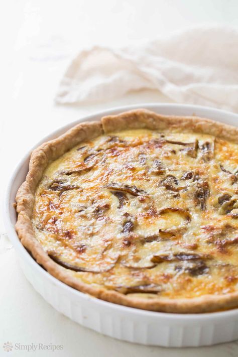 Caramelized Onion Quiche ~ Rich and creamy quiche with caramelized onions and Gruyere cheese.  ~ SimplyRecipes.com #breakfastandbrunch #french #vegetarian #quiche Caramelized Onion Quiche, Baking Weights, Onion Quiche, Smores Dessert, Mini Quiches, Quiche Recipe, Caramelized Onion, Oreo Dessert, Gruyere Cheese