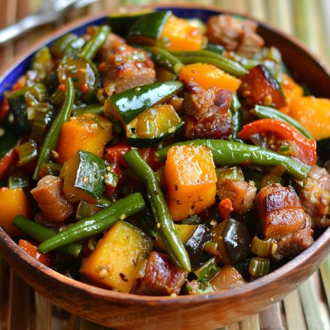 🌿 Enjoy a healthy and flavorful Filipino vegetable dish with Pinakbet! 🌿 #Pinakbet #HealthyEating Pinakbet Ingredients: Pork belly (1/2 lb, sliced) Bitter melon (1, sliced) Eggplant (1, cubed) Squash (1 cup, cubed) String beans (1 cup, cut into 2-inch pieces) Okra (1 cup, cut into 2-inch pieces) Tomatoes (2, quartered) Onion (1, chopped) Garlic (4 cloves, minced) Fish sauce (2 tbsp) Water (1 cup) Shrimp paste (2 tbsp) Instructions: Sauté garlic, onion, and tomatoes until soft. Add pork be... Pinakbet Recipe Filipino Food, Filipino Ulam, Pinakbet Recipe, Filipino Vegetable Dishes, Filipino Vegetable Recipes, Sliced Eggplant, Braising Recipes, Yummy Pasta, Filipino Dish