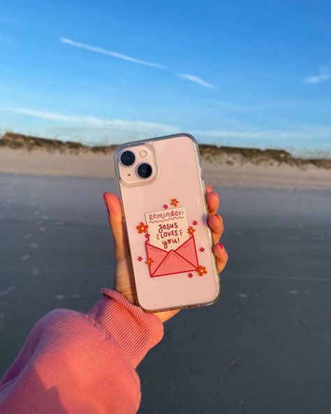 ALSO dropping on Friday August 2nd… new phone cases !!! Once again, these have been suchhh a work in progress, and I am beyond excited to launch them 🥹🫶🏼💖🌺 There will be a white case option, a pink case option, and a clear case!! The white + pink cases have the same hand drawn design (the cute little “stamps” with doodles & words about Jesus!), while the clear case has our “Reminder: Jesus Loves You” design on it 💌 These will fit most iPhones and a few Samsung options! I’ll give more info... Aesthetic Christian Phone Cases, Bible Phone Cases, Jesus Phone Cases, Phone Cases Clear, Doctor Halloween, Phone Case Ideas, Book Art Projects, Christian Phone Case, Bday List