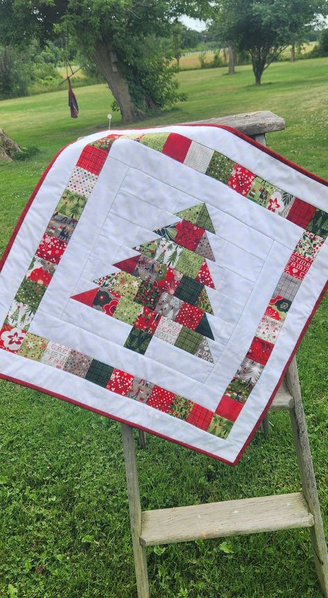 This super cute christmas tree made of Moda fabrics is sure to brighten up any room!  Wallhanging or tabletopper measures 26 square.  Machine pieced, machine quilted and hand bound. Made with 100% cotton Moda Hustle and Bustle Christmas fabric from Basic Grey.  Wonderful gift for you or anyone on your christmas list! Ready to ship! Find Christmas Pattern stock images in HD and millions of other royalty-free stock photos, illustrations and vectors Christmas Quilts Ideas, Christmas Tree Quilt Pattern, Christmas Tree Quilt Block, Tree Quilt Block, Christmas Table Runner Pattern, Quilted Table Runners Christmas, Christmas Quilting Projects, Little Christmas Tree, Christmas Tree Quilt