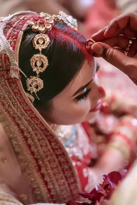 Did you know that sindoor is a mark of love, trust, respect and marriage? Here's an exciting insight into the rituals of Indian Wedding. #indianwedding #indianbride #indianweddingphotography #indianbride #sindoor #sindoorinhair #sindoor #traditions #weddingphotography #weddingphotographer #style #styleinspiration #styleicon Indian Wedding Photography Ideas, Hindu Wedding Rituals, Indian Wedding Rituals, Hindu Wedding Photos, Middle Class Family, Indian Wedding Aesthetic, Marriage Poses, Indian Wedding Pictures, Class Family