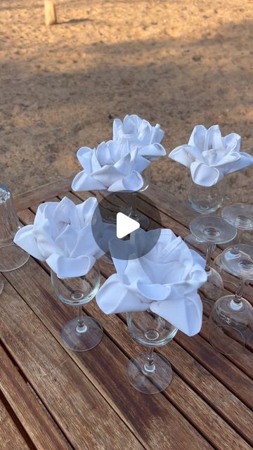 Umlani Bushcamp on Instagram: "Suzy showing me the art of napkin folding 🥰🌸🌺

📸 @irina_x_ithombe 

#napkinfolding #beautiful #flower #safaricamp #dinnertable #dinnertabledecor #decor #napkinart #art #umlanimagic #umlanibushcamp #comedinewithus" Napkin Folding Flower, Wedding Napkin Folding, Creative Napkin Fold, Beautiful Napkin Folding, Pink Table Settings, Fancy Napkin Folding, Napkin Rose, Gala Decorations, Creative Napkins