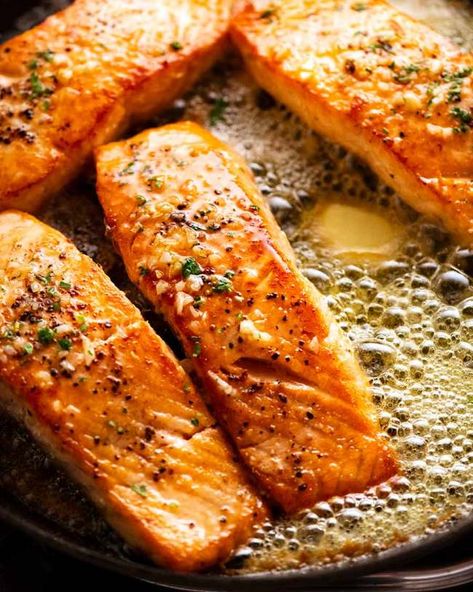 Garlic Butter Salmon in a skillet surrounded by foaming garlic butter Salmon In A Skillet, Garlic Salmon Recipes, Quick Salmon Recipes, Salmon Skillet, Quick Salmon, Sauce For Salmon, Garlic Butter Salmon, Butter Salmon, Garlic Salmon