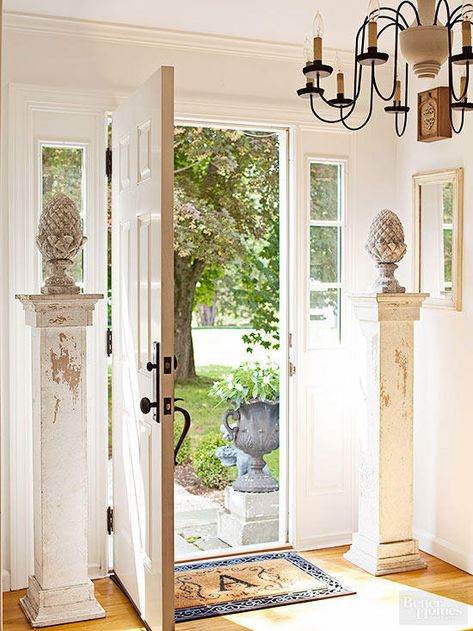 Grab up matching pairs of any type of salvaged architectural element. You'll find that having multiples of similar objects considerably stretches your design options, a point handily illustrated by these two columns, which fashionably frame a front door while performing as pedestals for antique garden ornaments. Salvaged Decor, Porch Columns, Estilo Shabby Chic, Architectural Pieces, Up House, Fireplace Surrounds, Architectural Salvage, Architectural Elements, Showcase Design